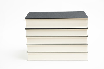 A Set Of Neatly Stacked Monochromatic Cloth Bound Books
