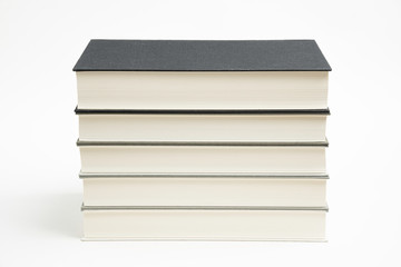 A Set Of Neatly Stacked Monochromatic Cloth Bound Books