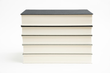 A Set Of Neatly Stacked Monochromatic Cloth Bound Books
