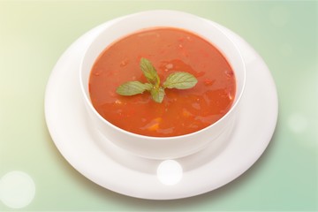 Fresh tomato soup on a white background
