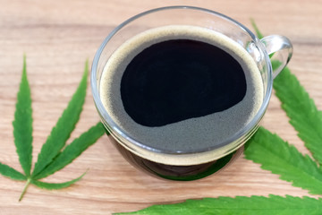 Black coffee with Cannabis(marijuana) leaves.