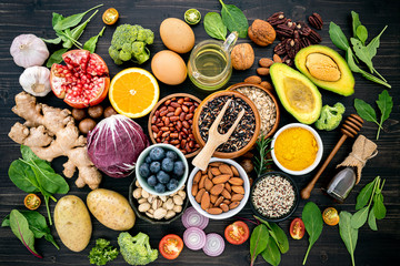 Ingredients for the healthy foods selection. The concept of healthy food set up on wooden background.