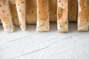 sliced bread on wooden background