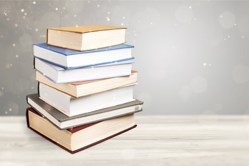 Ancient books in a row on wooden