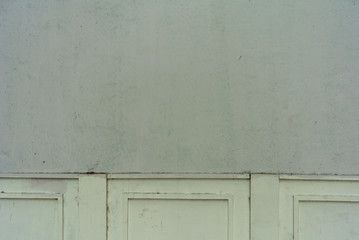 old brick wall with wooden door and window