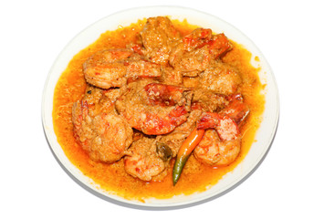 Indian spicy food shrimp curry prepared with coconut served as side dish with rice isolated on white background