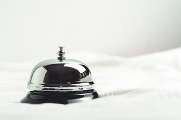 Service concept. Silver reception bell on white background making it vintage color tone