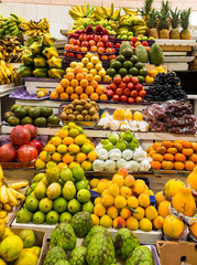 Market stall selling varied and colorful fruits
