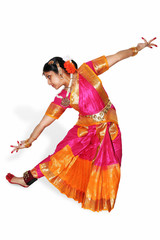 Woman dancer perform Bharatanatyam Indian classical dance in traditional costumes isolated on white...