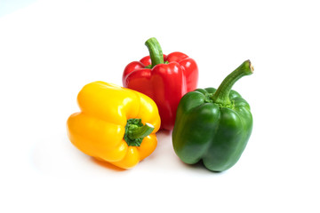 Fresh three color sweet peppers isolated on white background