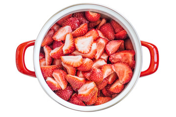 Strawberry sliced in a saucepan on a white background. Isolate.