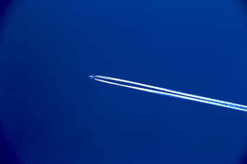 Minimalist Airplane with Contrail