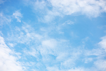 Blue sky background and white clouds soft focus, and copy space