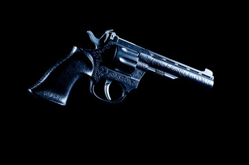 Plastic gun on a black background, isolate