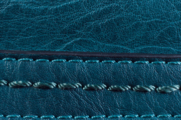 Beautiful smooth seam on the blue leather bag, close-up