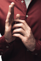Plakat cropped shot of man gesturing with hands isolated on grey, human emotion and expression concept