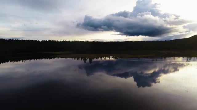 Aerial view of a lake in Sweden. The sky gets reflected in the lake.