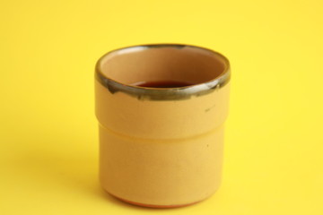 earthenware glass filled with red wine