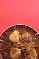 dish of stewed beef with potatoes and carrot