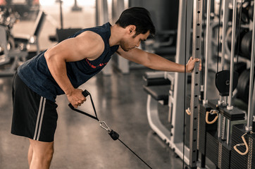 Fototapeta na wymiar Man workout at the gym