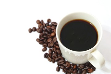 Coffee cup and beans on a white background.