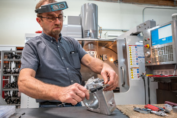 Engineer verefiying accuracy of a part