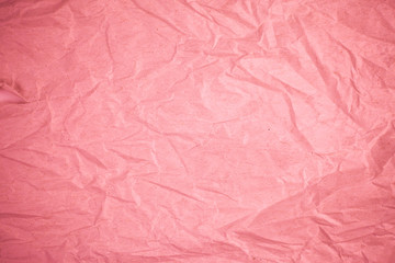 Crumpled recycle pink paper background.