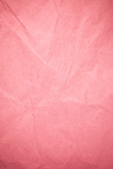 Fototapeta premium Crumpled recycle pink paper background.