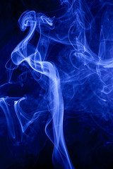 Blue smoke on a black backgroug.