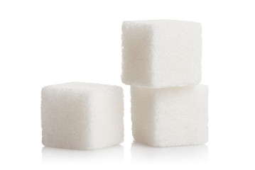 Close-up of three white sugar cubes, isolated on white background