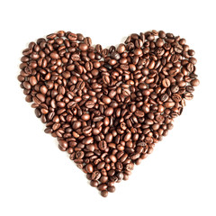 Coffee grains isolated on white background top view. Coffee time concept. Coffee beans on a white background scattered in the shape of a heart