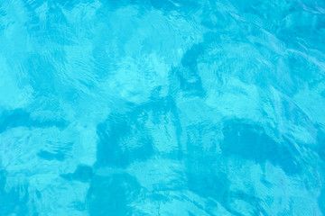 Close-up view of a transparent turquoise sea water that forms a natural texture, Emerald Coast, Sardinia, Italy.