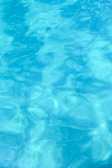 Close-up view of a transparent turquoise sea water that forms a natural texture, Emerald Coast, Sardinia, Italy.