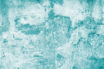 Fototapeta na wymiar Turquoise shabby concrete wall with flaky plaster. Torn rough old texture. Vintage, cracked distressed background. Abstract green pattern. Virid paint stains on white canvas. Creative illustration 