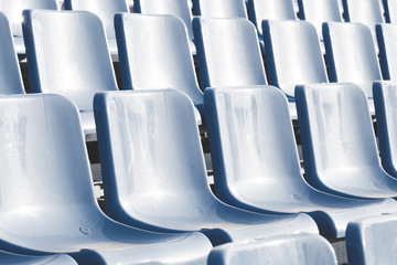 empty blue seats in outdoor stadium. empty stadium concept.