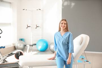 Fototapeta na wymiar Female physiotherapist in rehabilitation center