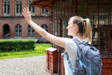 Female tourist near beautiful old building