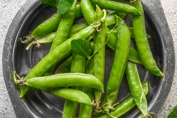 Tasty fresh peas on plate, closeup