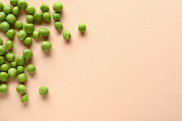 Tasty fresh peas on color background