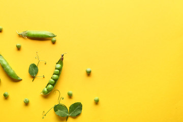 Tasty fresh peas on color background