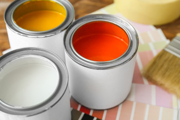 Cans of paint on table, closeup
