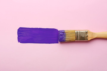 Brush with paint stroke on color background