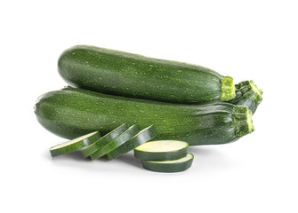 Fresh zucchini squashes on white background