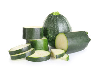 Fresh zucchini squashes on white background