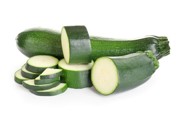 Fresh zucchini squashes on white background