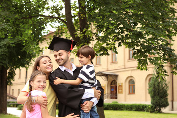 Happy man with his family on graduation day
