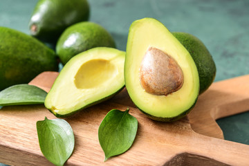 Fresh ripe avocados on wooden boards