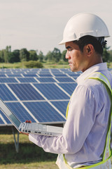 Expertise service team working on measuring efficiency of operation and maintenance at solar plant; engineer working on checking and maintenance electrical equipment