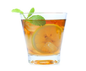 iced tea with lemon slices and mint on white background