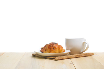 Coffee and croissants on the wood